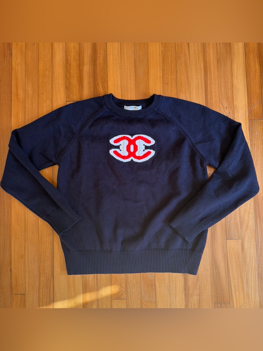 CHANEL Black Crewneck Sweater with Red and White Logo